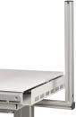 Preview: The image shows a modern desk with a white, smooth surface. On one side there is a vertical, gray metal profile that appears stable and robust.