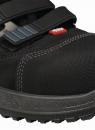 Preview: The image shows a black sports or cycling shoe with a sturdy upper. It has two black straps for closure and a grippy sole with a textured tread.