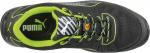 Preview: The image shows a sports shoe from Puma. It is primarily black with green accents. The laces are patterned, and the sole has a textured surface.