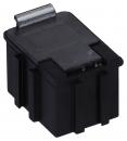 Preview: The image shows a small, rectangular, black box with a flat lid and side grooves. On the top, there is a metal flap. It resembles a connector.