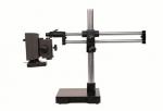 Preview: The image shows an optical table with a stable base. Attached to the vertical column are two rails, on which an arm with a camera or lens is mounted.