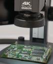 Preview: The image displays a green circuit board under a microscope, labeled 
