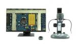 Preview: In the image, on the left there is a monitor displaying a close-up of a circuit board, and on the right a microscope with several connections and a sturdy base.