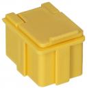 Preview: The image shows a small, square container made of yellow plastic. It has a flat lid and side notches. The edges are rounded, and it is sturdily designed.
