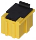 Preview: The image shows a small, square connector. It is predominantly yellow with a black lid and has two vertical grooves on the sides. The lid has a small loop attachment.