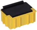 Preview: The image shows a rectangular, yellow plug or a box with a black cover on top. The sides are textured with vertical grooves. The shape is compact and sturdy.