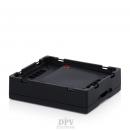 Preview: The image displays a black, square electronics box with slightly raised edges. The surface is plain and matte, with recesses on the sides. The background is white.