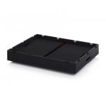 Preview: The image shows a flat, black box with slightly raised edges and a central division. The surface is smooth and there are a few small openings on the sides.