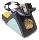 Preview: The image shows a kitchen gadget equipped with a sponge and a metal brush. It has a black base and a gray top, which is ergonomically shaped.