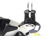 Preview: The image displays a technical device with two black handles and a round, flat holder. The holder features a rectangular opening and is equipped with screws.