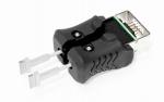 Preview: The image shows a black adapter with two silver pins protruding forward. At the top, a connection is visible, displaying a green and black area.