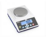 Preview: The image shows a digital scale with a round, smooth metal weighing surface. Below are buttons and a blue screen that displays the weight.