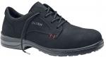 Preview: The shoe is a black, lace-up safety shoe with a sturdy upper. The sole is slip-resistant and has a raised edge. Red accents are visible on the side.