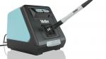Preview: The image shows a soldering station with a black casing and a turquoise side. A soldering iron is inserted into a holder. The brand 