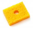 Preview: The image shows a yellow sponge in a rectangular shape with a round opening in the middle. The surface is porous and soft, typical for household cleaning utensils.
