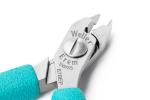 Preview: The image shows a small pair of pliers with pointed, sharp edges made of shiny silver metal. The handle is in a light turquoise blue. There are markings for the manufacturer on the top of the pliers.