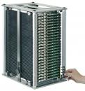 Preview: The image shows a rectangular metal device bay with several vertically arranged green circuit boards. A hand reaches for the left side of the device.