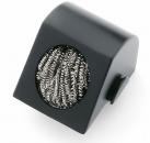 Preview: The image shows a black, slanted block with a round opening. Inside, there is a silver metal grid. It could be a cleaning brush.