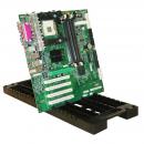 Preview: The image shows a green circuit board, designed with many small components, wires, and slots. It is tilted on a black, sturdy surface.