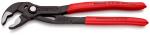 Preview: The image shows a black pair of pliers with red handles. The pliers have an adjustable opening, wider at the top and narrower at the bottom, ideal for gripping objects.