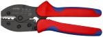 Preview: The image shows a combination pliers with red ergonomic handles and a black, metal head. The pliers have a serrated edge, ideal for gripping and cutting.