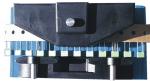Preview: The image shows a device with a black top part and a blue base. Below, two round rollers are visible. On the side, there are several green and white switches or buttons.
