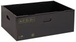 Preview: The image shows a black, rectangular cardboard box. It has two side handle holes and is open, without a lid. The surface is textured and there are some symbols on the front.