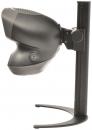 Preview: The image displays a black device with a round, dome-shaped top, mounted on a stable base. It features a button on the front and appears compact.
