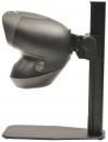 Preview: The image shows a black-colored scanner with a round head structure, mounted on a stable base. On the side, there is a rotary control and a power switch.