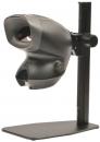 Preview: The image shows a black, compact device mounted on a stable stand. It has a round opening on the front and rotary knobs for adjustment. It appears modern and functional.