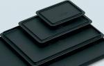 Preview: The image displays multiple black, rectangular trays in various sizes. They are stacked on top of each other, with the largest at the bottom and the smallest on top.