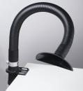 Preview: The image shows a flexible, black hose attached to a table. At the end of the hose, there is a round, open shaft. The hose is likely used for extracting fumes or dust.