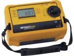 Preview: The image displays a compact, rectangular measuring device in bright yellow with a digital display and a large rotary knob. There are several buttons and a carrying strap on the side.