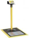 Preview: The image shows a yellow, upright column with a display on top. Below it is a square platform with round and oval imprints. The entire area is in yellow and black.